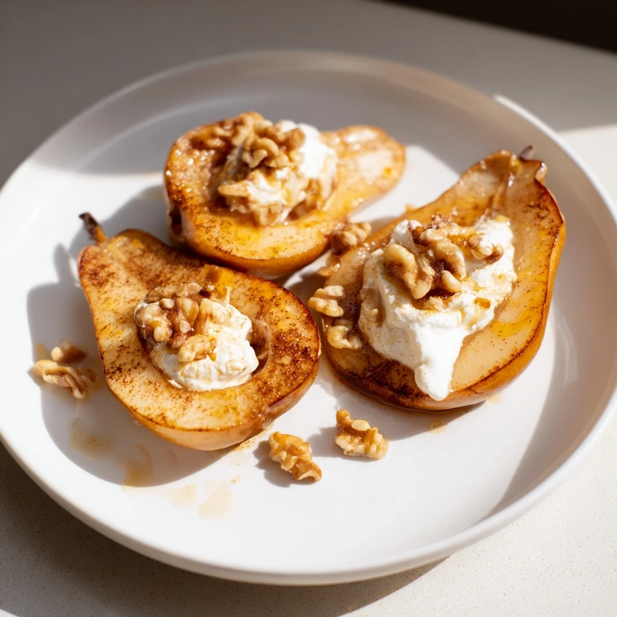 Beautifully caramelized roasted pears are served with Greek yogurt, walnuts, creating a healthy delight.