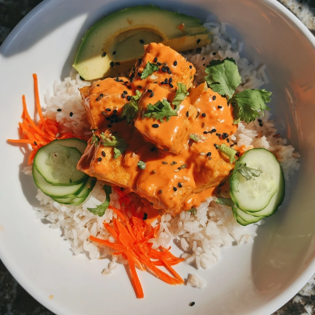 A close-up view of flavorful Chili-Mayo Baked Tofu Bowls, ready to eat, over fluffy jasmine rice.