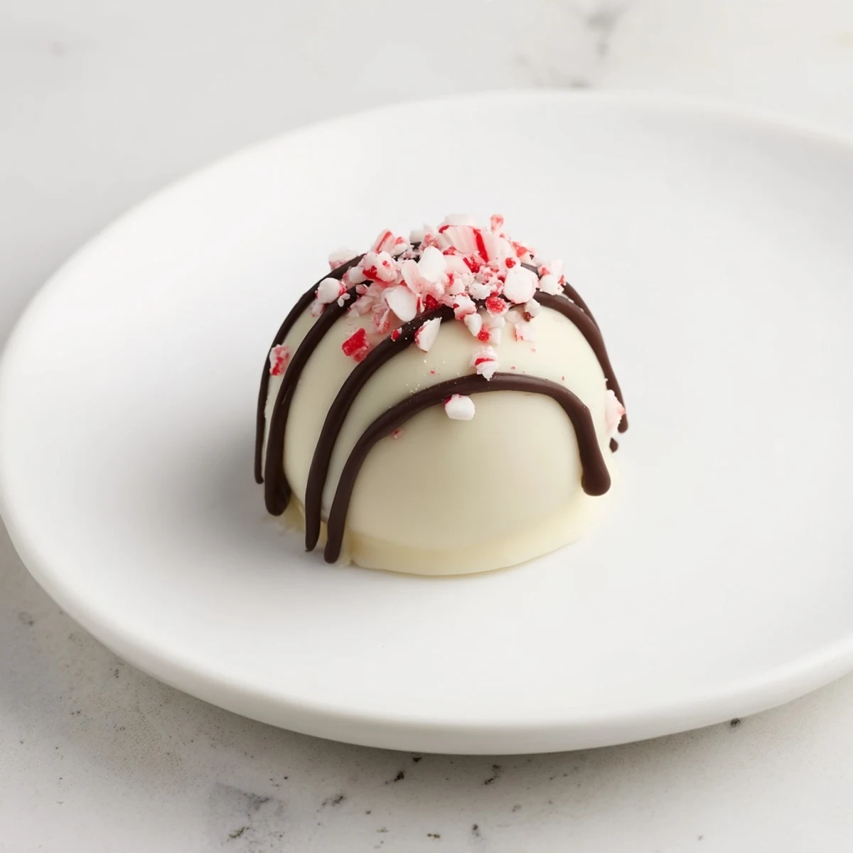 Creamy Simplified Christmas Oreo Truffles glistening with white chocolate and colorful holiday sprinkles.