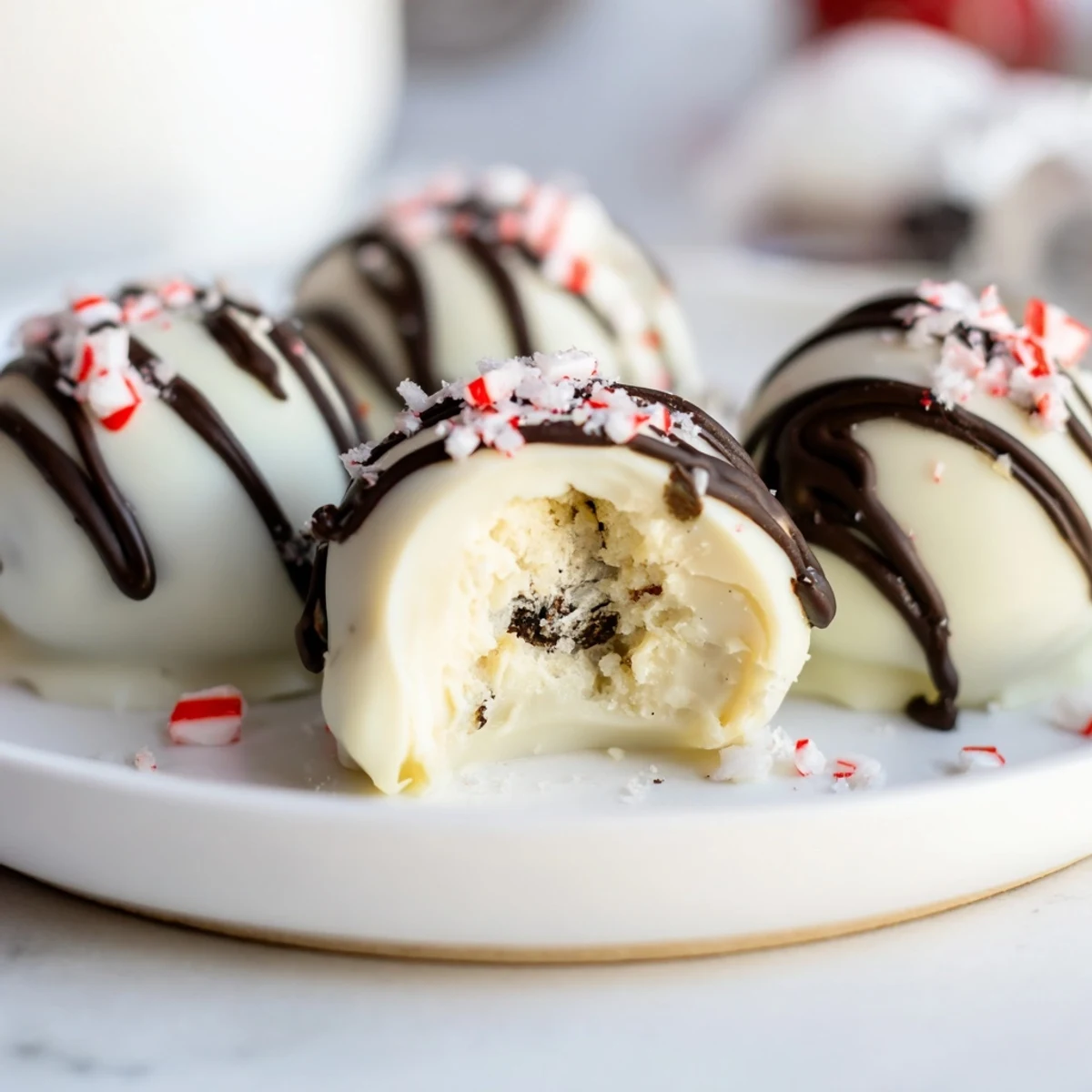A close-up of decadent Simplified Christmas Oreo Truffles, ready to eat after a quick chill in the fridge.