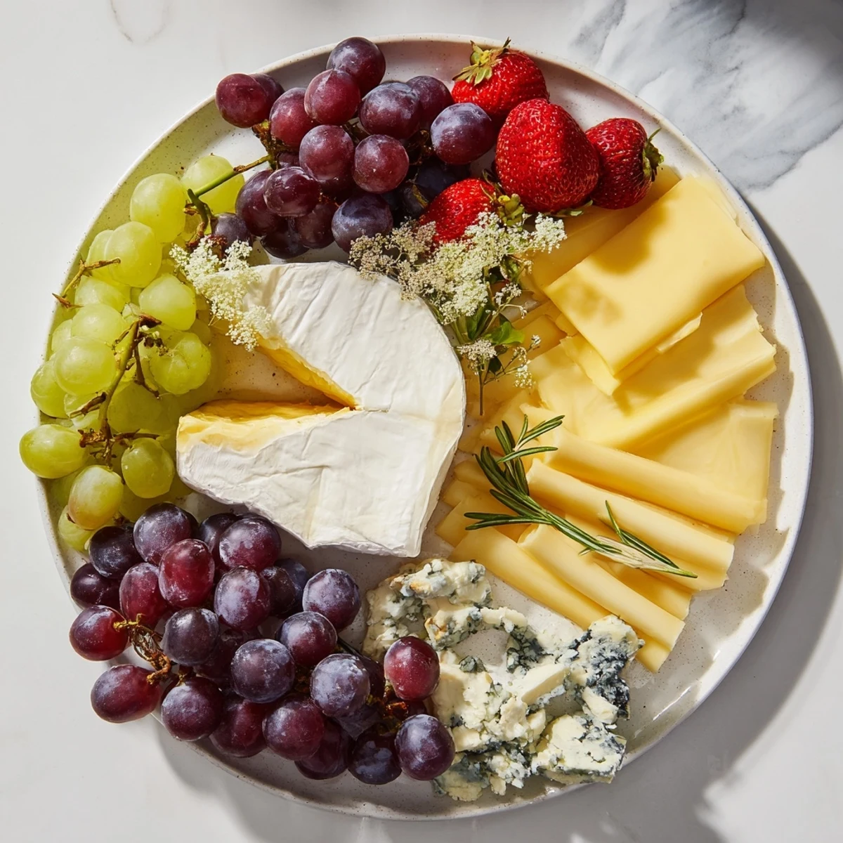 Imagine this Enchanted Forest Grazing Board: a beautiful medley of cheeses, fruits, and bread arranged to graze upon.