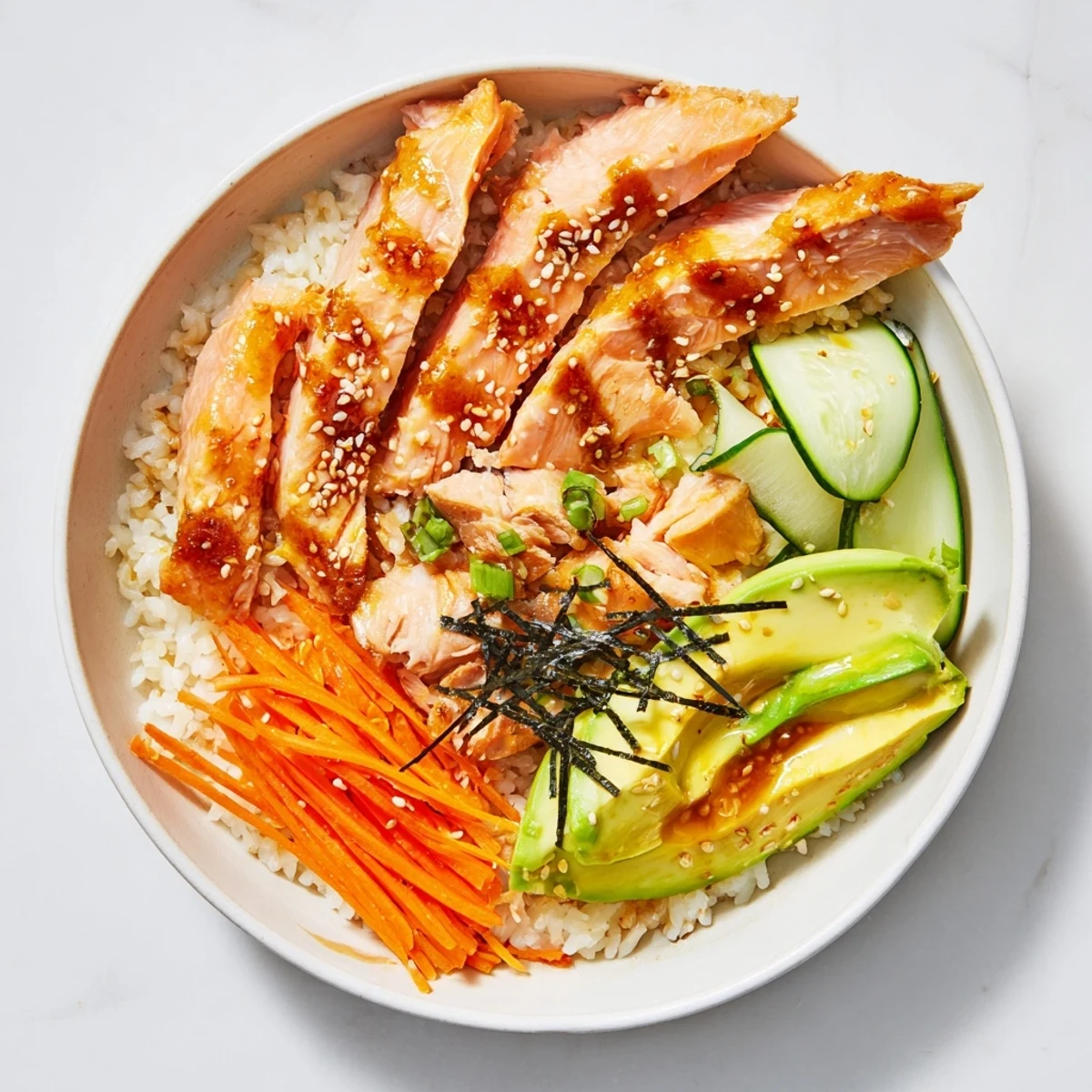 Savory Japanese-style Salmon & Chicken Rice Bowl with flaked salmon, tender chicken, and colorful toppings.