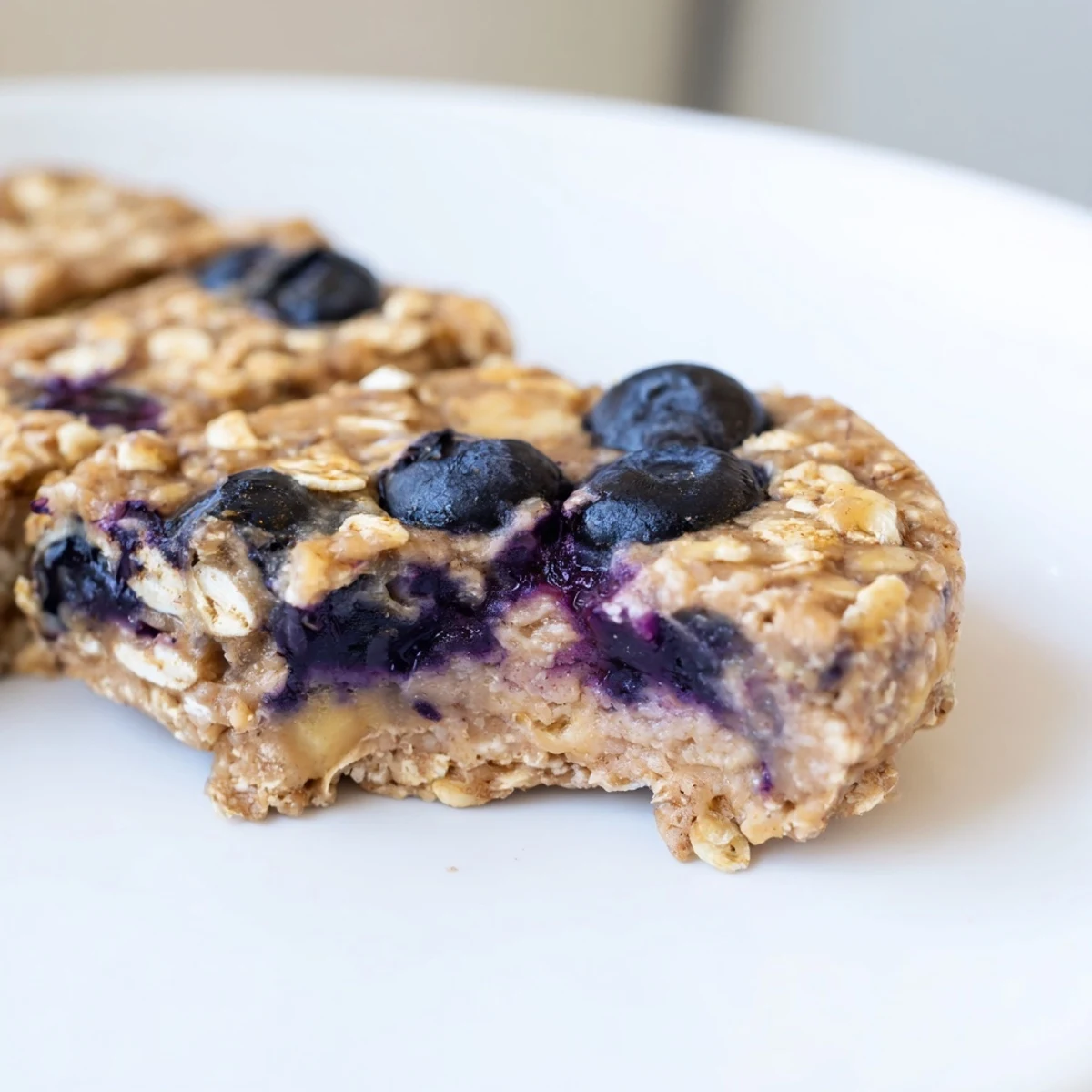 A close-up of delicious Blueberry Banana Oatmeal Protein Bars, ideal as a quick and healthy snack.