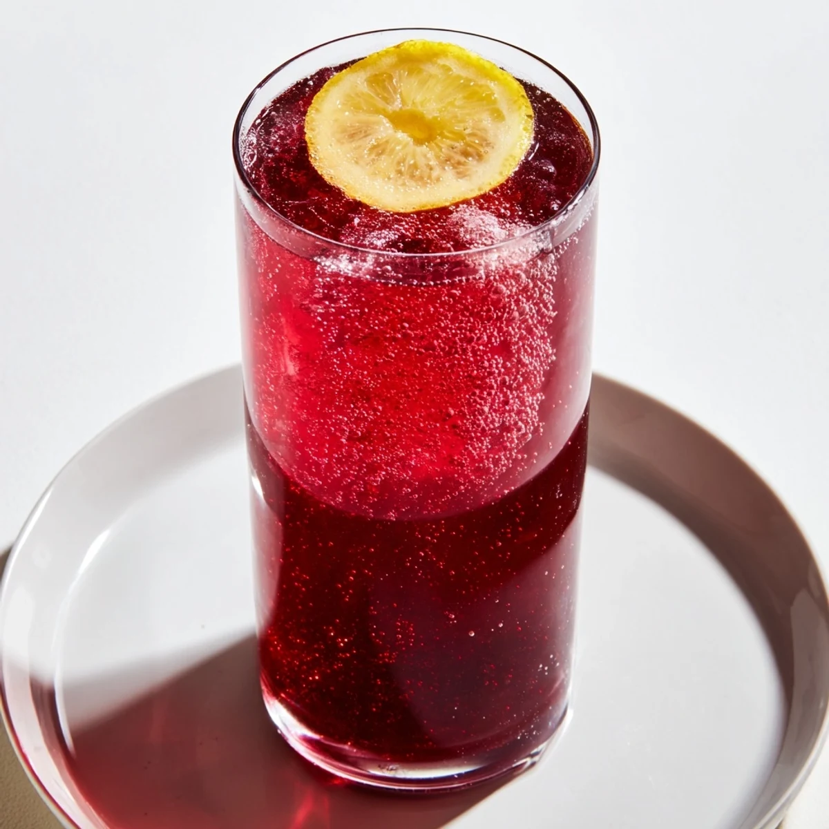 Enjoy a refreshing Sleepy Girl Mocktail, a tart cherry juice and magnesium blend served over ice for relaxation.