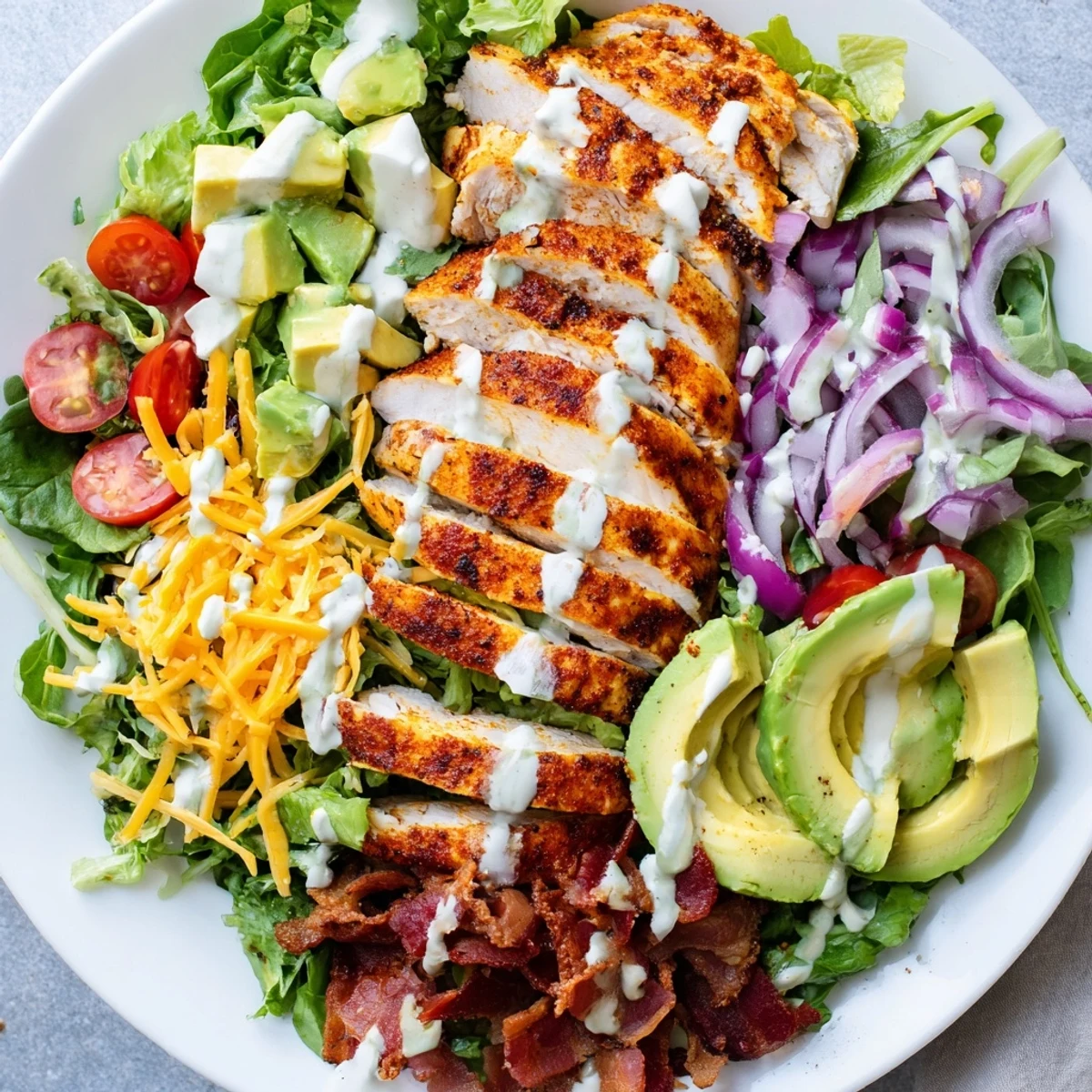 Crispy Bacon Chicken Salad with juicy chicken, crispy bacon bits, and creamy ranch dressing on fresh greens.