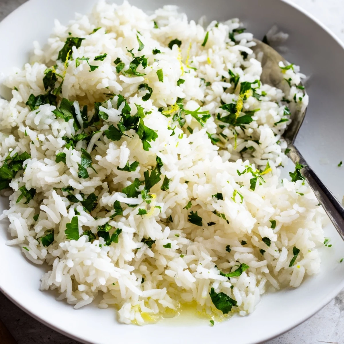 Fluffy Cilantro Lime Rice glistening with fresh lime, ready to serve as a tasty side dish.