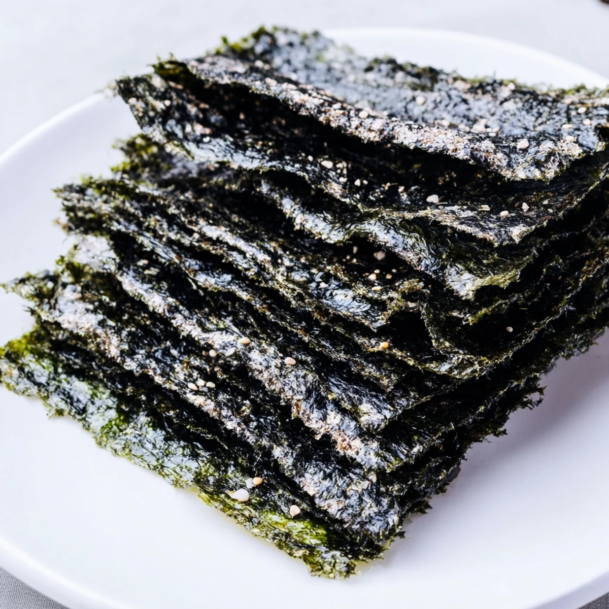 Homemade roasted seaweed chips lightly brushed with sesame oil, offering a crisp, salty bite in each piece.