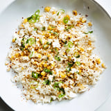 Bright image: creamy Mexican Street Corn Rice with charred corn and crumbled cotija cheese visible.