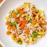 Savory Egg Fried Rice featuring golden eggs and fresh scallions, ready to serve quick.
