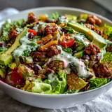 Colorful, healthy taco salad featuring lean turkey, crunchy romaine, and tangy Greek yogurt ranch—perfect for a quick dinner.  
