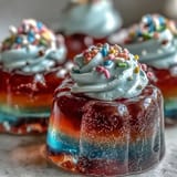 Kids will love these colorful Rainbow Jello Cups, perfect for a fun, chilled party dessert.