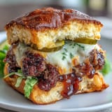 Crispy-edged smash burger sliders, slathered in tangy secret sauce, ready for grilling.