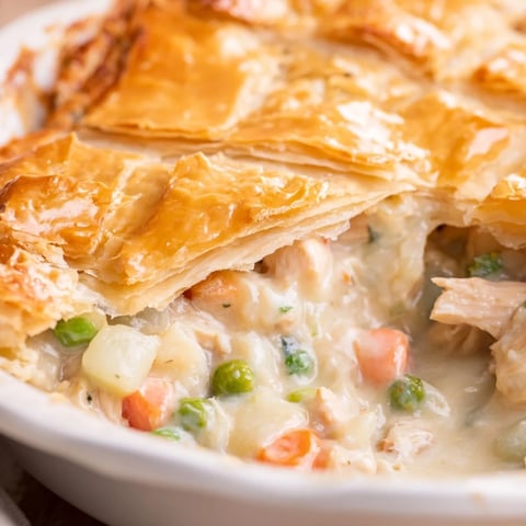 Golden-brown classic chicken pot pie with flaky crust and creamy filling.  