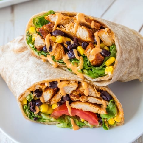 Crispy Southwest Chicken Wrap, brimming with chicken, veggies, and creamy dressing, perfect for lunch.