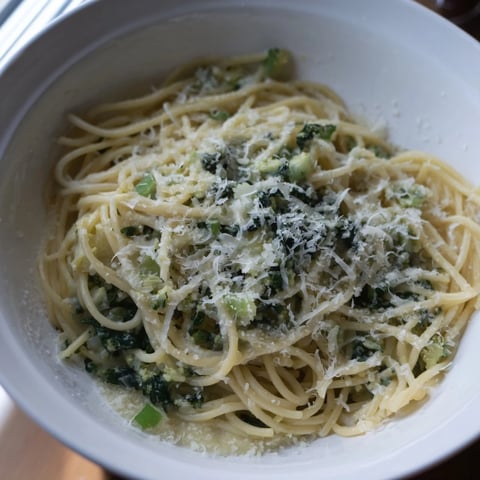 Golden-brown Creamy Roasted Cauliflower Garlic Pasta, garnished with fresh herbs and Parmesan, ready to serve.