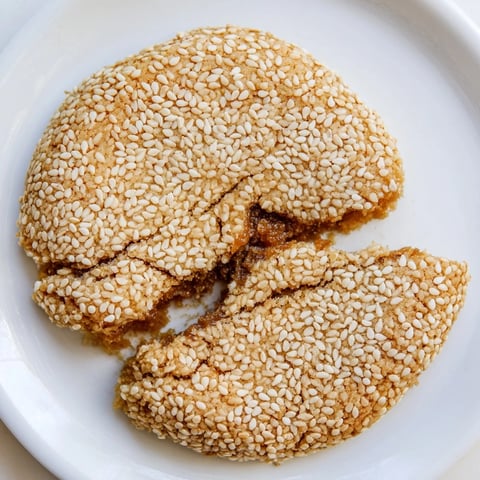 Golden-brown Palestinian Kahk cookies, fragrant with cinnamon and sesame seeds, ready to enjoy.