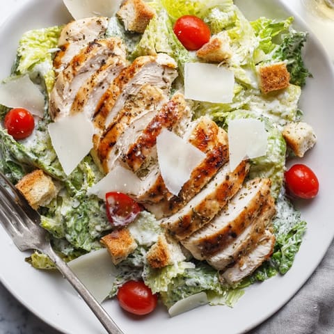 Vibrant romaine lettuce, savory grilled chicken, and Parmesan unite in this Caesar salad.  