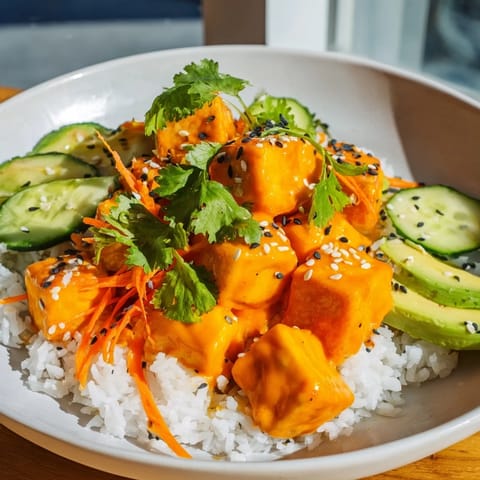 These Chili-Mayo Baked Tofu Bowls present savory, saucy tofu with colorful fresh veggie toppings.