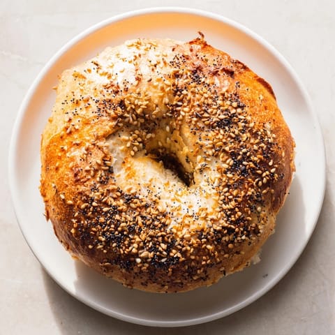 Crispy sesame-topped Homemade Budget Bagels with a satisfying chewy texture—ideal for a delightful brunch.
