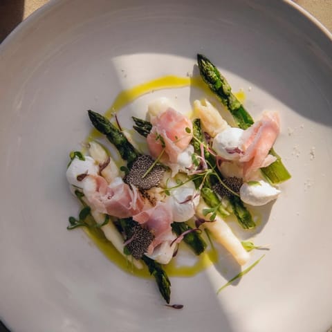 A light and flavorful Silver Birch dish, boasting creamy cheeses and tender asparagus spears.