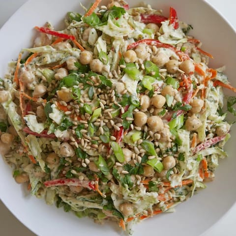 This image shows a fresh Fiber-Forward Chickpea Salad, perfect for a light, healthy meal and side dishes.