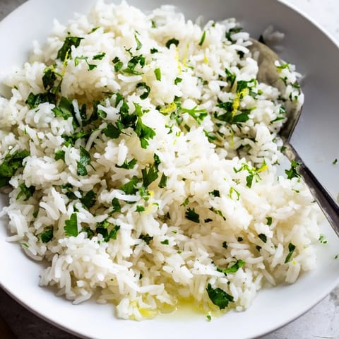 Fluffy Cilantro Lime Rice glistening with fresh lime, ready to serve as a tasty side dish.