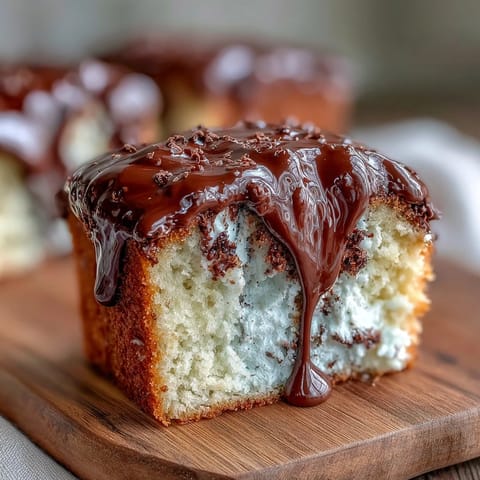 Graduation cake with white chocolate drip and gold balloons, perfect for celebrating academic achievements with style.