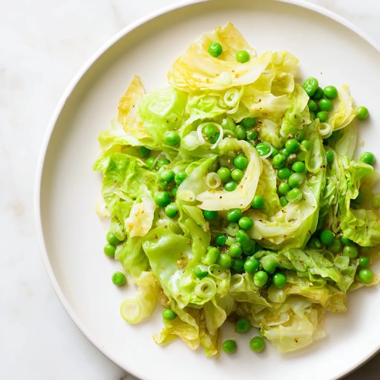 The garlic-kissed cabbage stir-fry with frozen peas, ready to serve over fluffy rice, looks delicious.