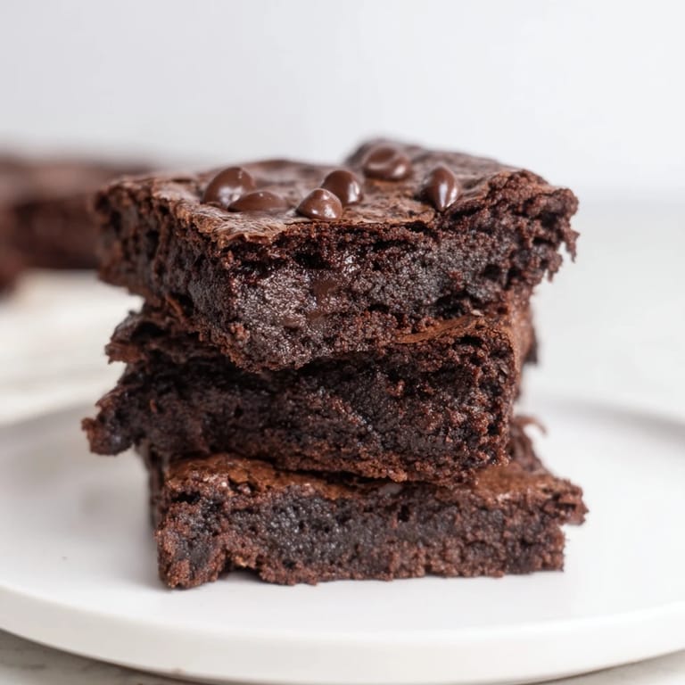 A pan of freshly baked Black Bean Brownies, showcasing a moist, delicious texture.