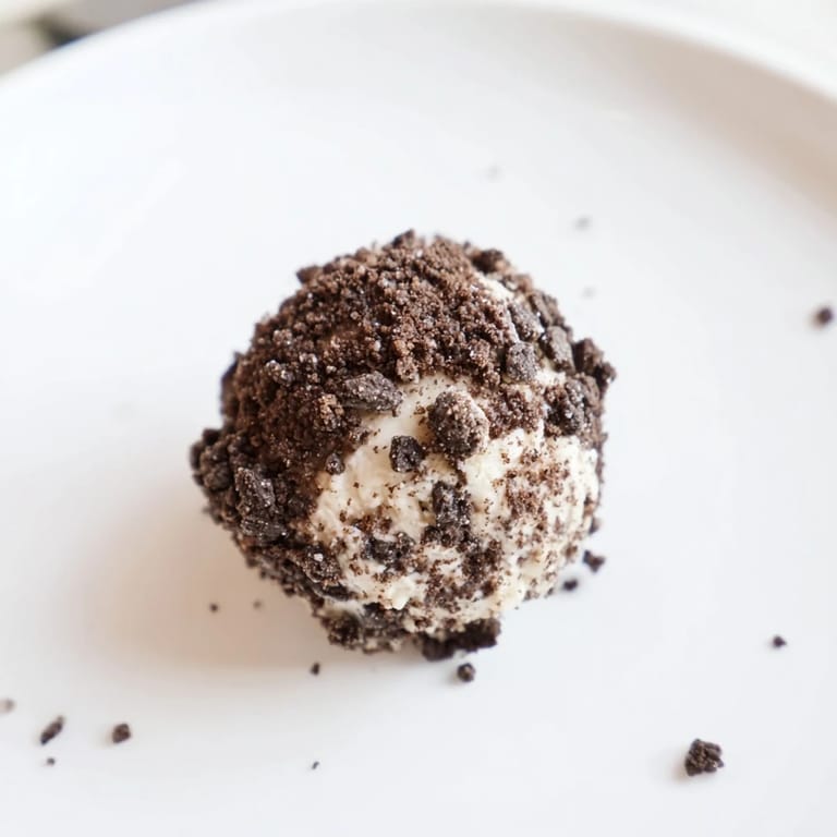 Imagine sweet, no-bake Cream Cheese Oreo Protein Balls: a delicious, healthy snack with cookie pieces and protein.