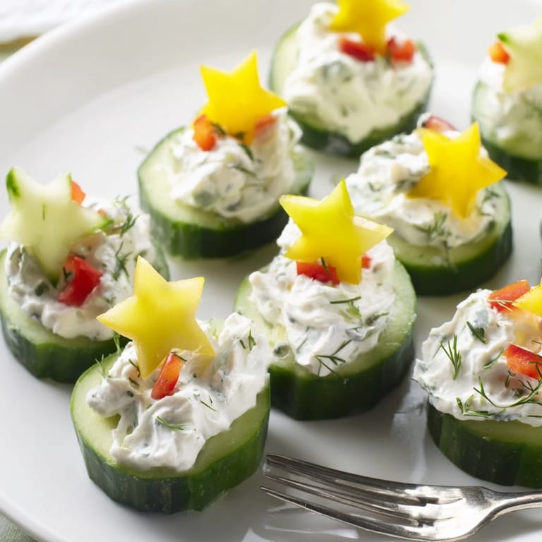 Bright, creamy Holiday Star Cucumber Bites are a delightful appetizer, ready for a holiday celebration.