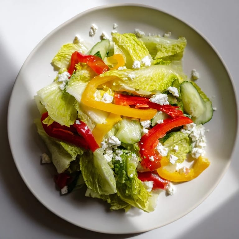 Crisp, refreshing Bella Hadid Salad: a vibrant mix of greens, cucumbers, and peppers, ready for lunch.