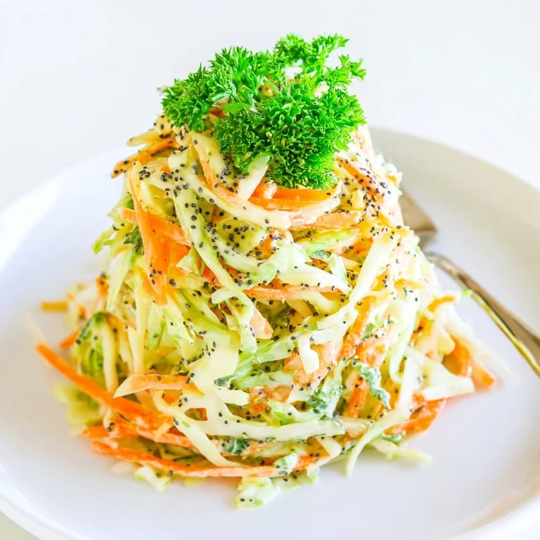 Freshly grated carrots and green onions add color to this crunchy Green Cabbage and Apple Slaw.