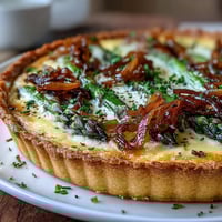 Spring Asparagus Quiche with Gruyère and caramelized shallots in a golden, flaky crust.  